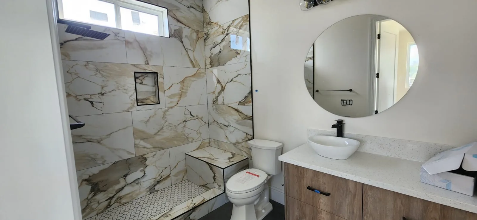 Finished bathroom sink and faucet installation — completed plumbing work
